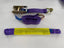 Purple webbed lifting strap with metal hooks and a ratchet buckle, shown on a white background.