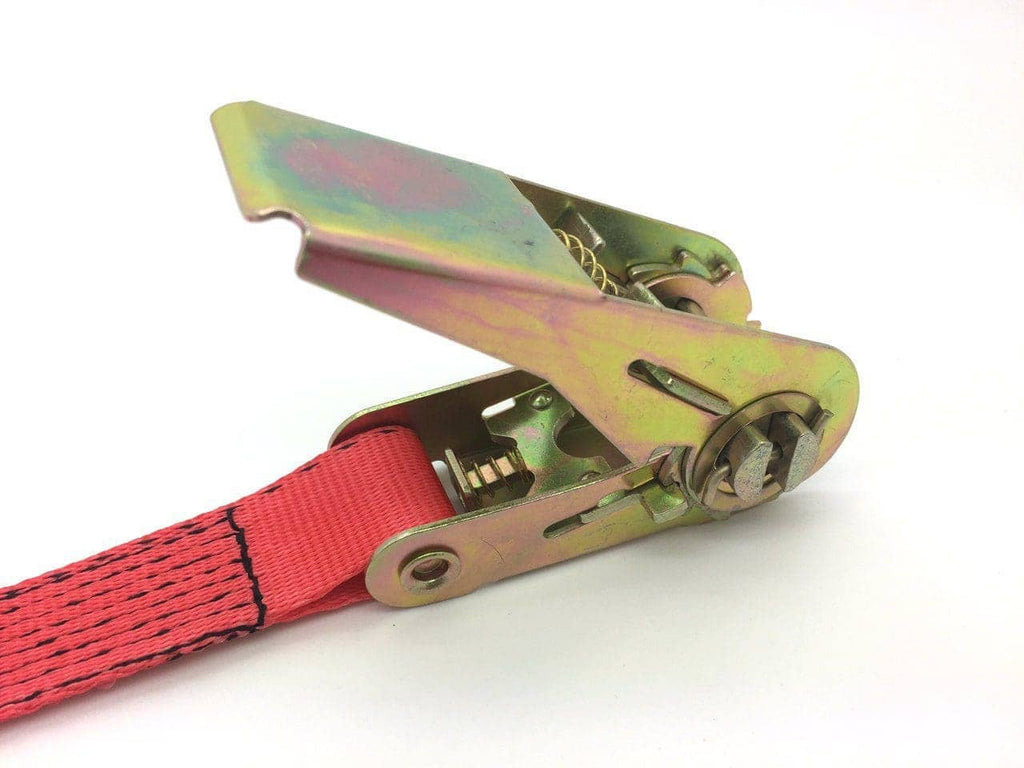 Close-up of metal ratchet mechanism on red ratchet strap tie downs for secure load fastening