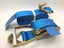 Blue ratchet straps tie down with metal hooks and durable stitching for secure load fastening