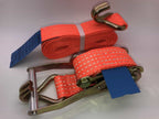 Orange ratchet straps tie down with metal hooks and ratchet mechanism for securing loads